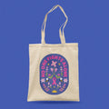Beige tote bag with a pink ribbon design and 'No One Fights Alone' text affirmation for breast cancer patient